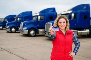 Female driver holding a CDL